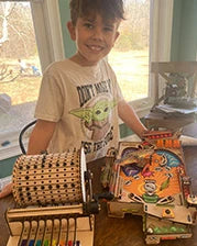 Boy with his Music Machine and Pinball builds